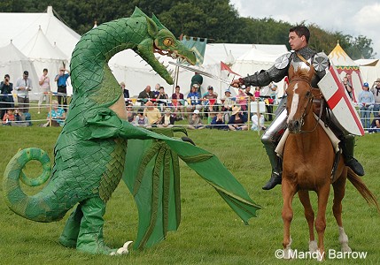 St George fights the dragon with his sword